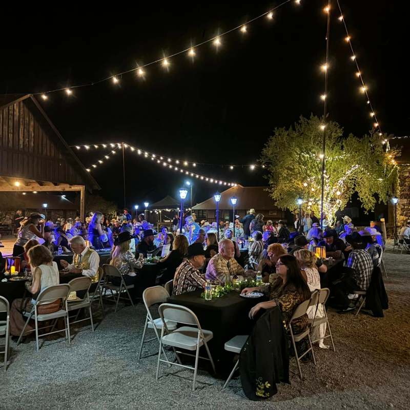 a group of people performing on stage in front of a crowd