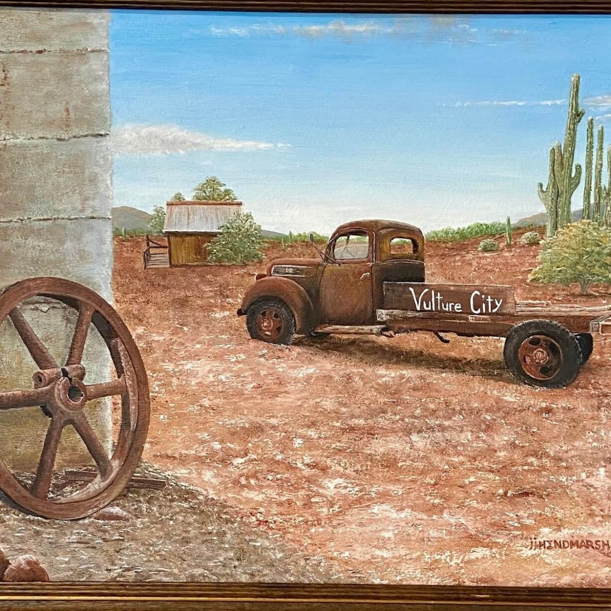 a car parked on the side of a dirt field