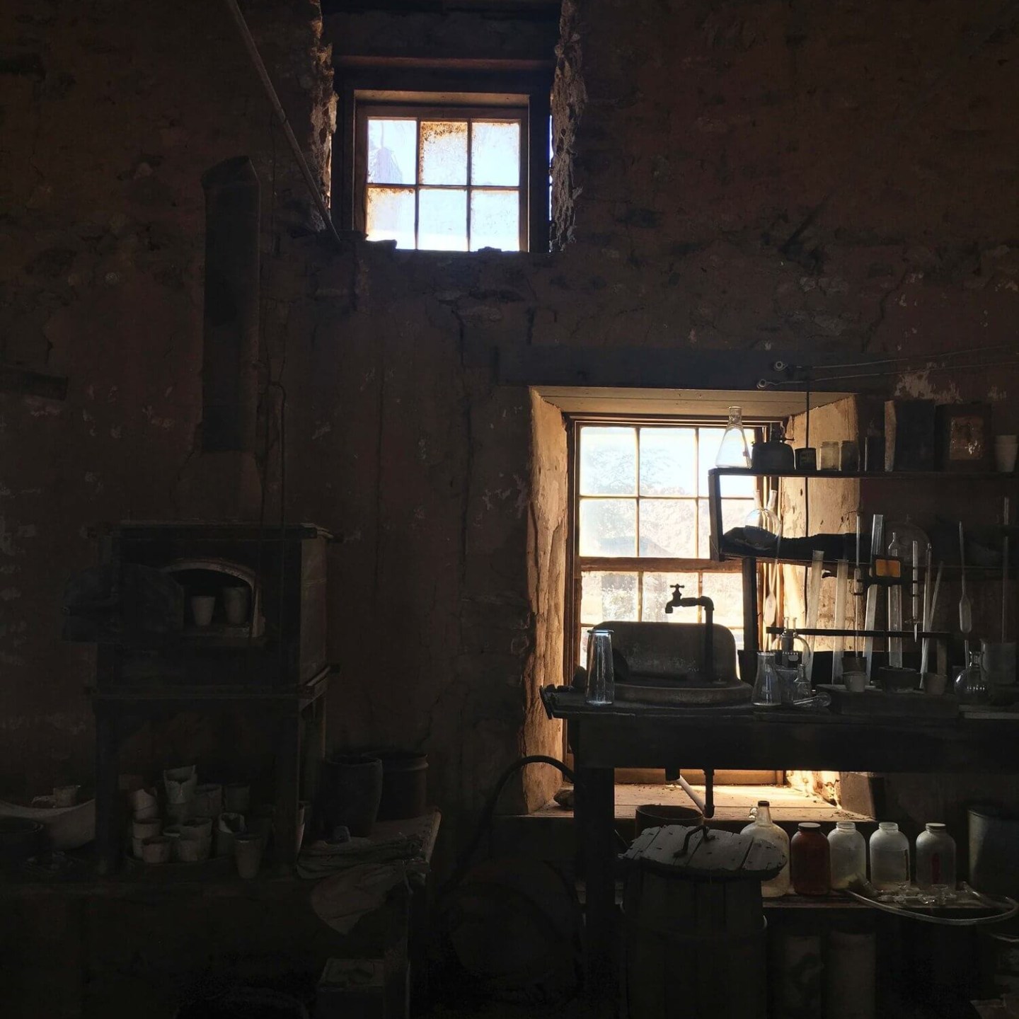 a room filled with furniture and a large window