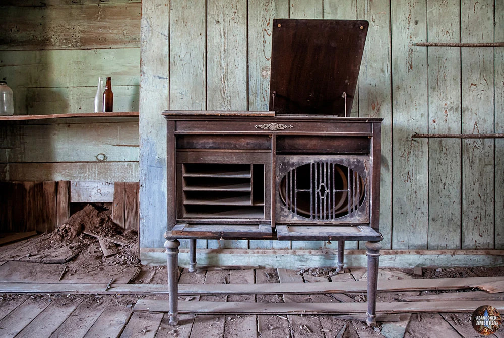 a wooden bench sitting next to a fireplace