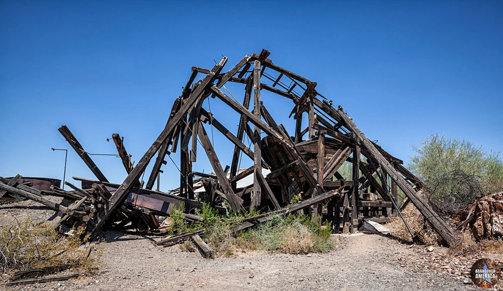 a pile of dirt near a bridge