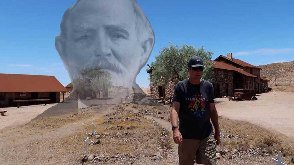 a man that is standing in the dirt