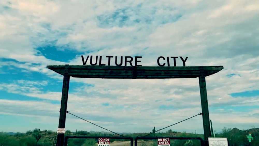 a sign on a cloudy day